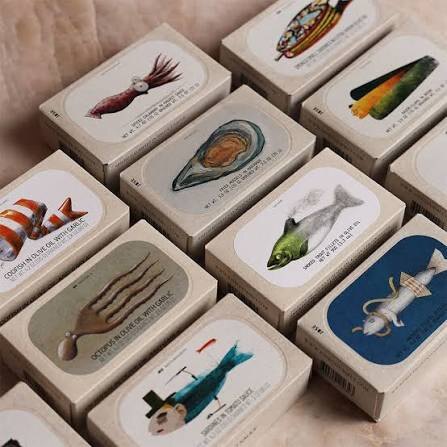 José Gourmet tins with illustrated labels of squid, oyster, octopus and fish