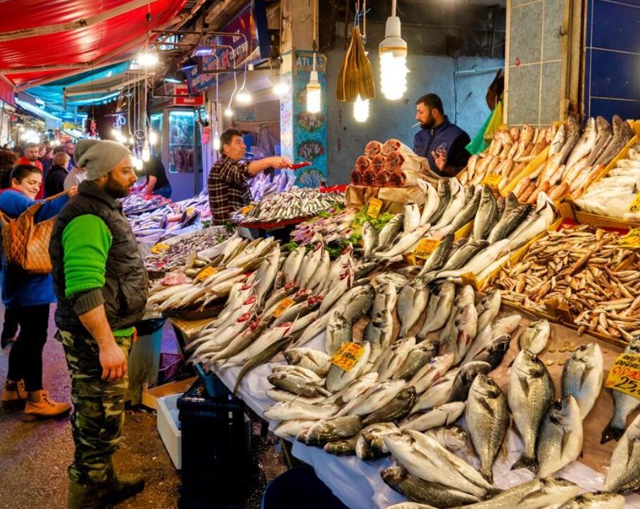 Busy fish market stall at night